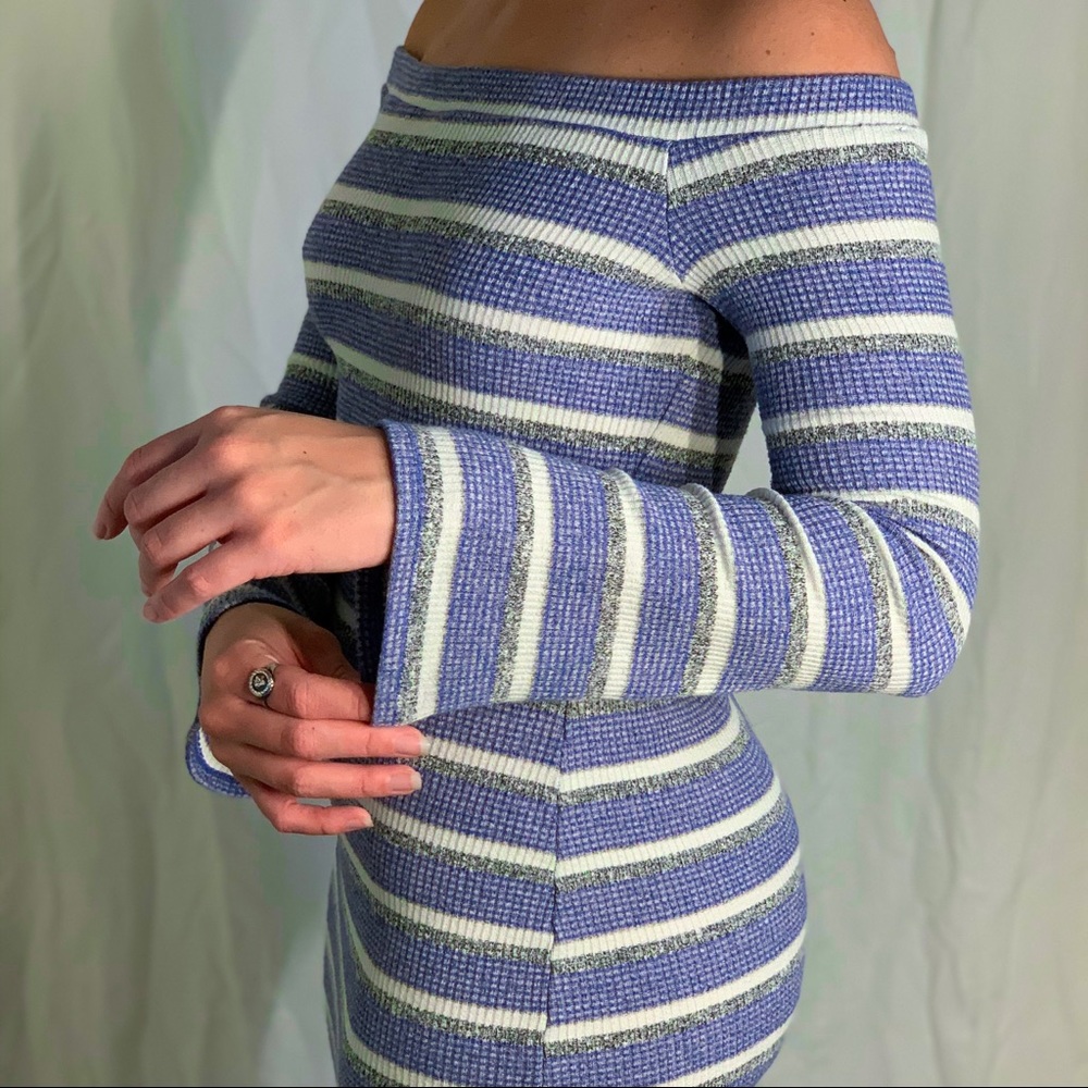 Off the shoulder knit dress with bell sleeves from the brand Socialite.